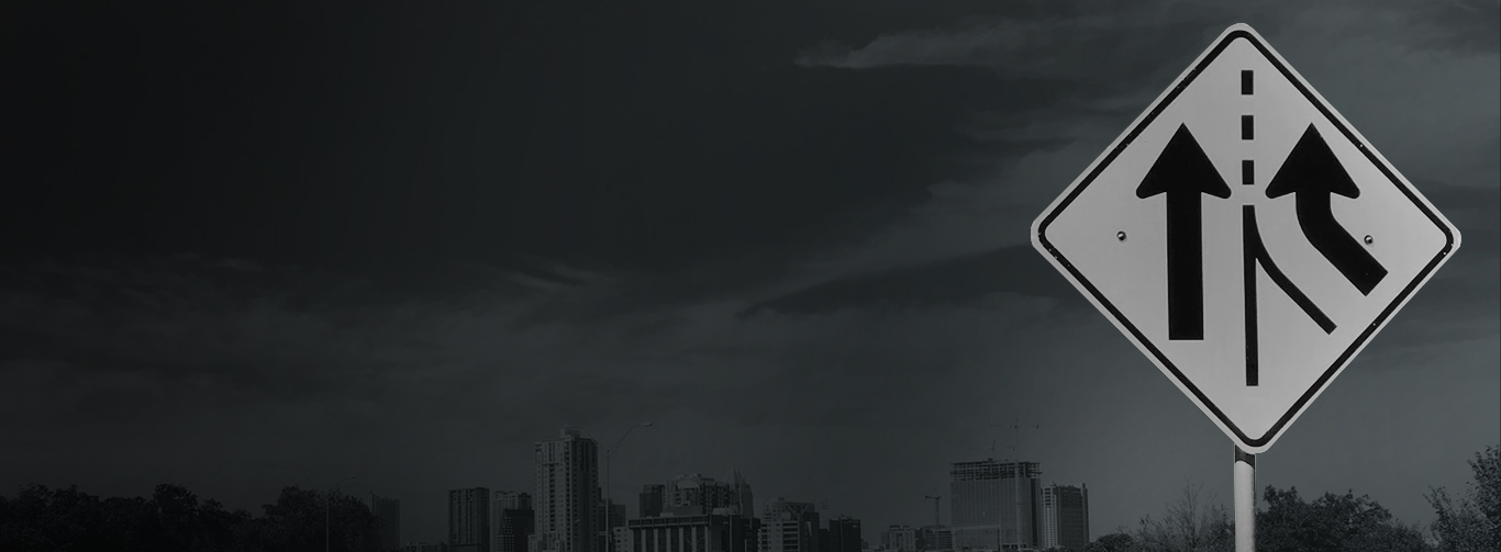 Black and White image of a merging street sign